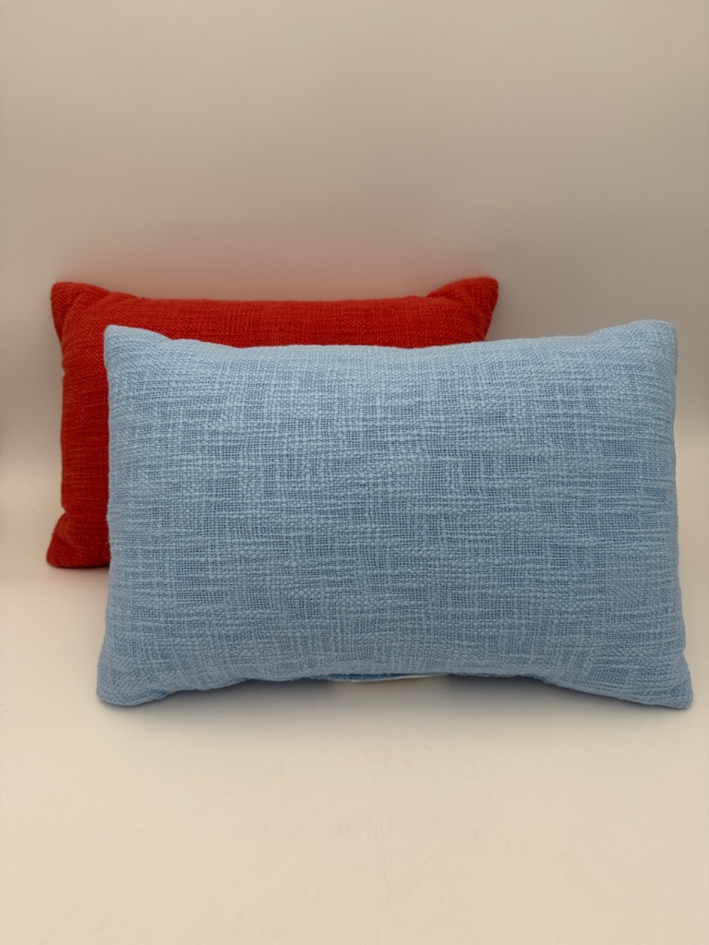Set of Two Decorative Pillows in Light Blue and Red